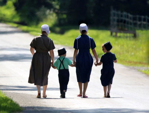 Amish women with their children